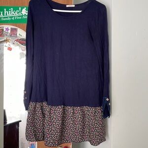 Long sleeve navy dress with flowered bottom . Lace button sleeves.
